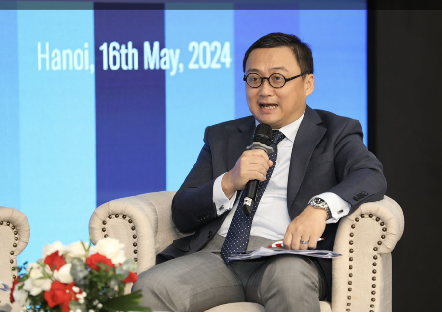 ông Trần Lê Minh, Tổng Giám đốc Công ty Cổ phần Xếp hạng Tín thác Đầu tư Việt Nam VIS Rating, phát biểu tại hội nghị ngày 17/5. Ảnh: Việt Dũng.
